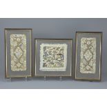 Three Chinese 19th century framed embroidered panels with gold thread. (3)