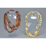 One ethnic horn cylindrical bead necklace together with a stone bead necklace and agate beaded neckl