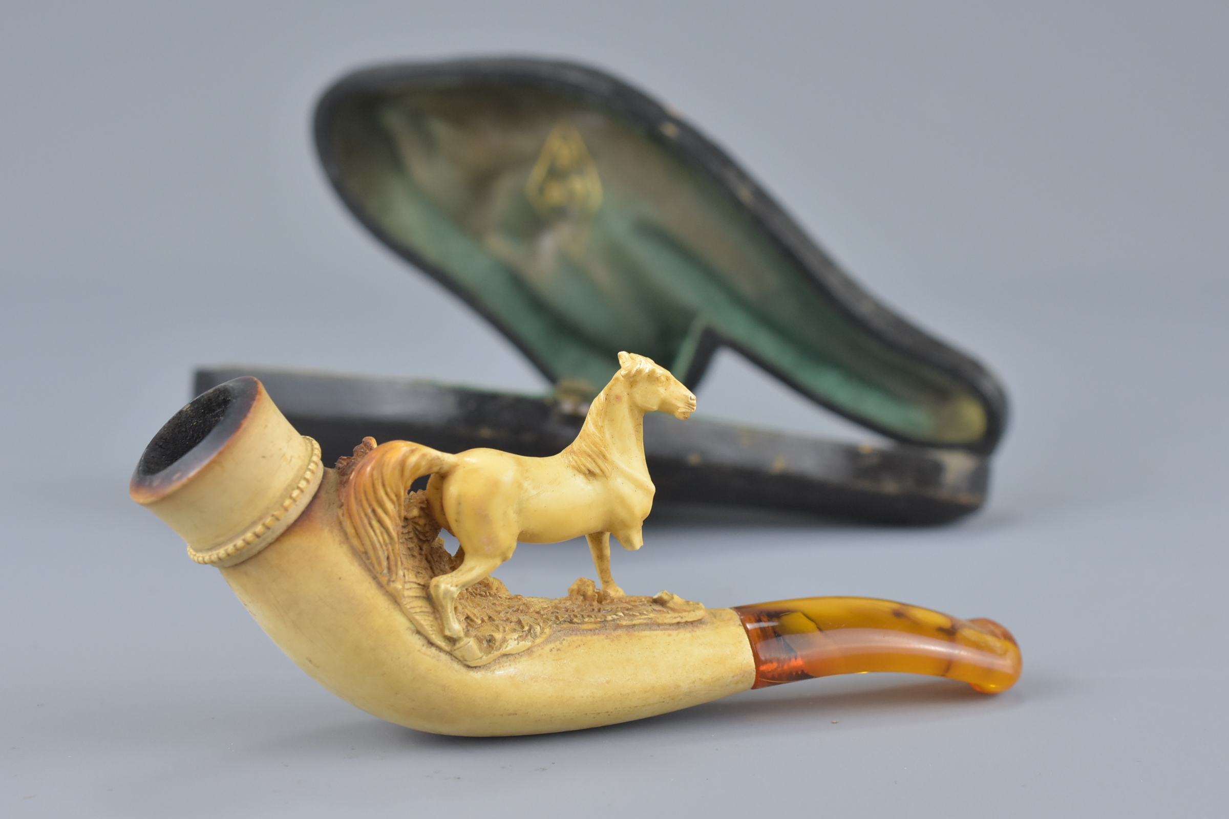 Cased 19th century Meerschaum Pipe in the form of a Horse with Amber Mouth Piece, 11cms