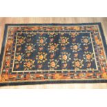 A large Tibetan / Chinese 19th century dark blue ground rug