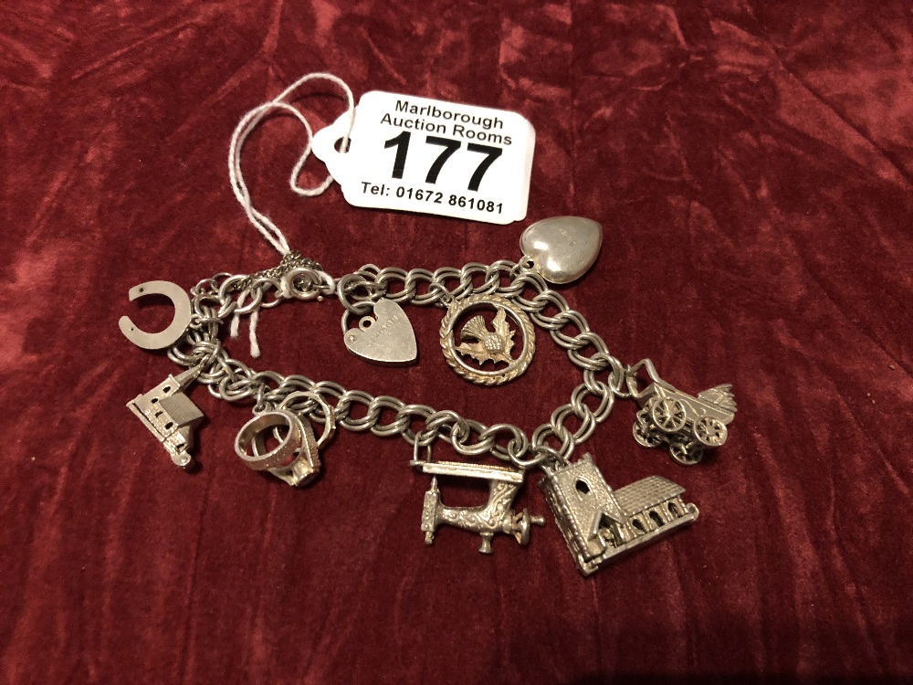 A silver charm bracelet. Hallmarked London 1976 with charms.