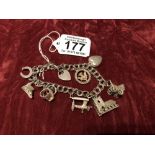 A silver charm bracelet. Hallmarked London 1976 with charms.