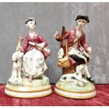 A pair of continental hard paste porcelain figurines.