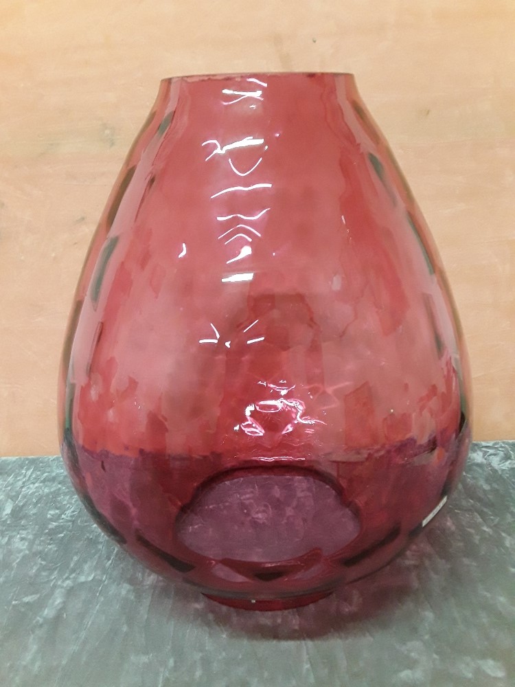 A large hand blown Cranberry glass shade for an oil lamp.