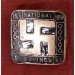 An early National Savings enamel lapel badge with swastika. 2cms square.