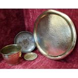 A large brass platter together with two bowls and a small plate.