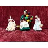 A Royal Doulton figurine, "The Balloon Seller" H.N.1315 plus two other miniatures.