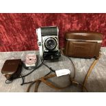 A Kodak Retina 1b camera and vintage Etalon Automat-A light exposure meter.