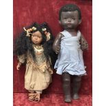 An English made black walking doll from 1960s and one other.