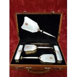 A stunning lady’s silver and guilloche boxed brushing set.