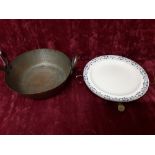 A copper dish warmer and a handbeaten double handled bowl.