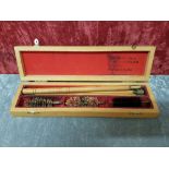 A boxed gun cleaning rod set.