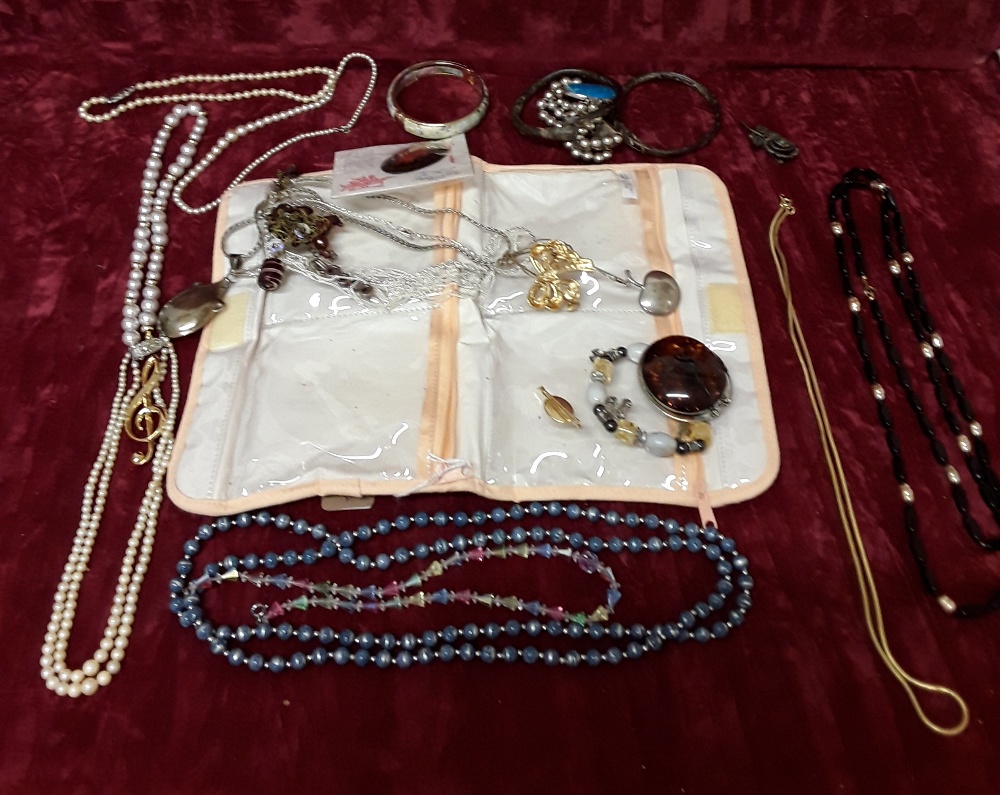 A selection of costume jewellery including silver.