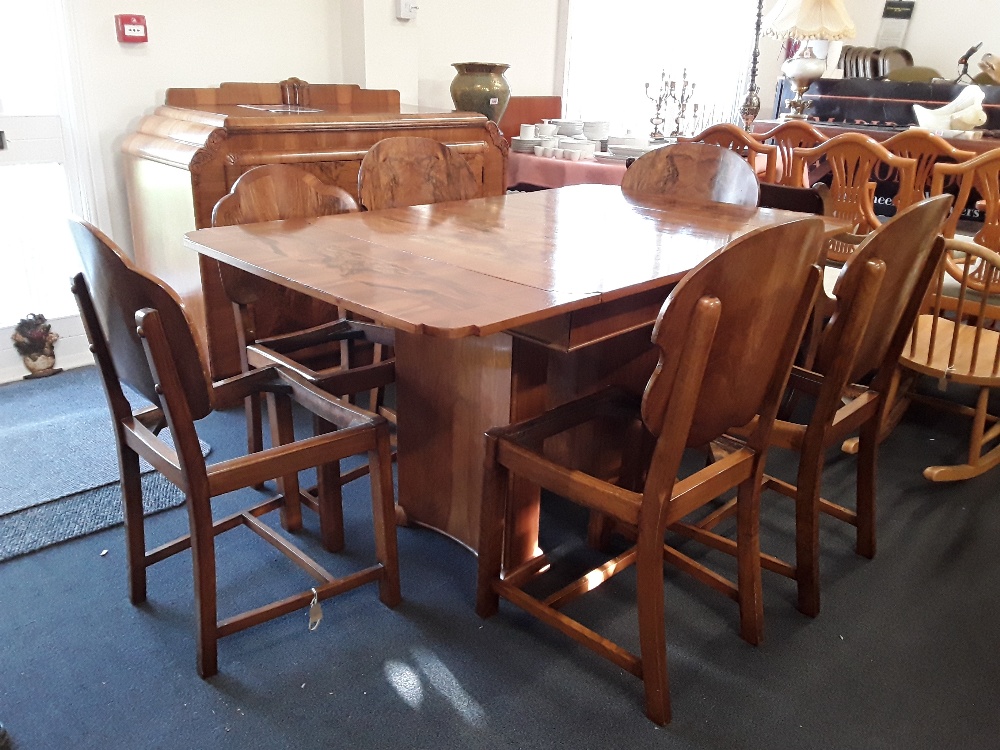 A stunning Art Deco burr walnut extendable dining table and matching sideboard drinks cabinet.