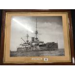 A framed and glazed photograph of H.M.S. Prince George.