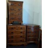 A set of three small chest of drawers.