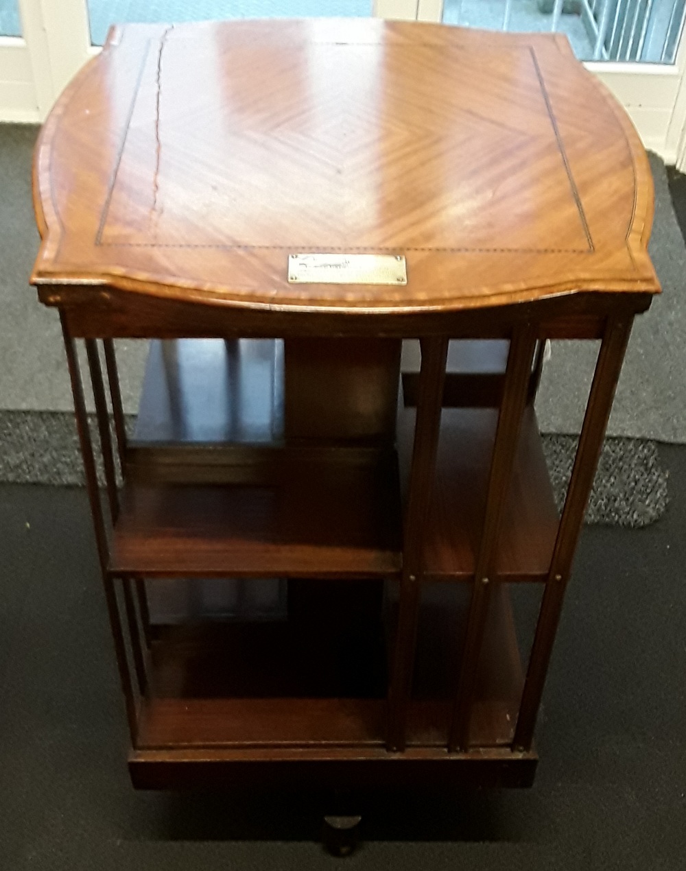 A 1920's mahogany two tier revolving book case