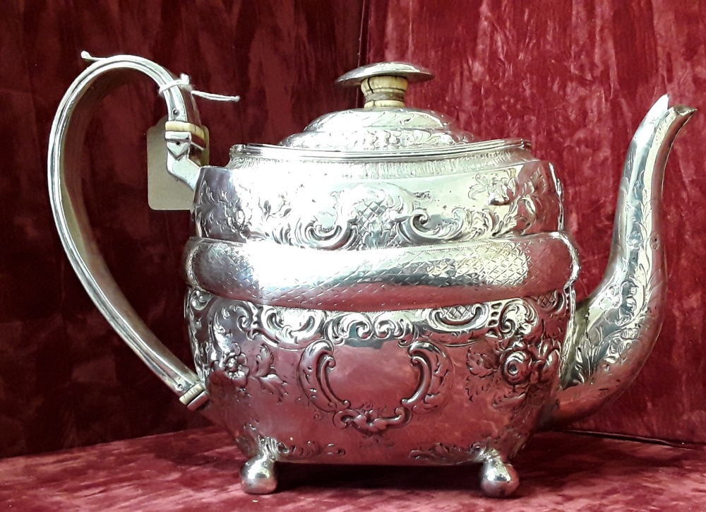 An early 19th Century silver cuboid shaped teapot.