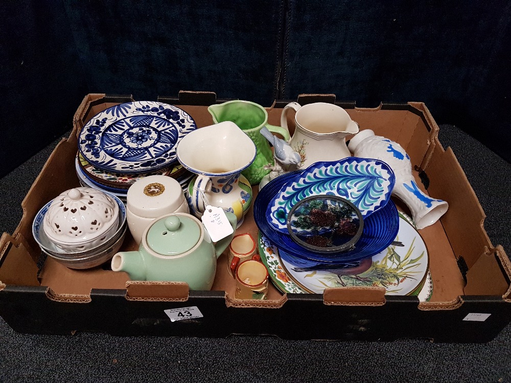 A collection of mixed ceramics and glass of various ages and styles.