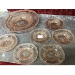 A set of pink Art Deco vaseline glass dishes of various sizes.
