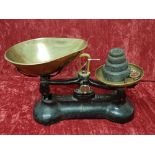 A set of kitchen scales by Brasco with weights.