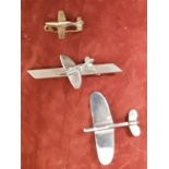 Three WW2 Spitfire sweetheart brooches. Largest wingspan 4cms.