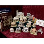 A collection of 14 unboxed Lilliput Lane buildings and a set of Collector's books and catalogues.