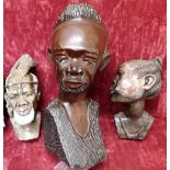 Three busts of African men and a woman.