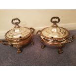 A pair of silver plated lidded soup tureens with “Palm of Hand” trademark to base.