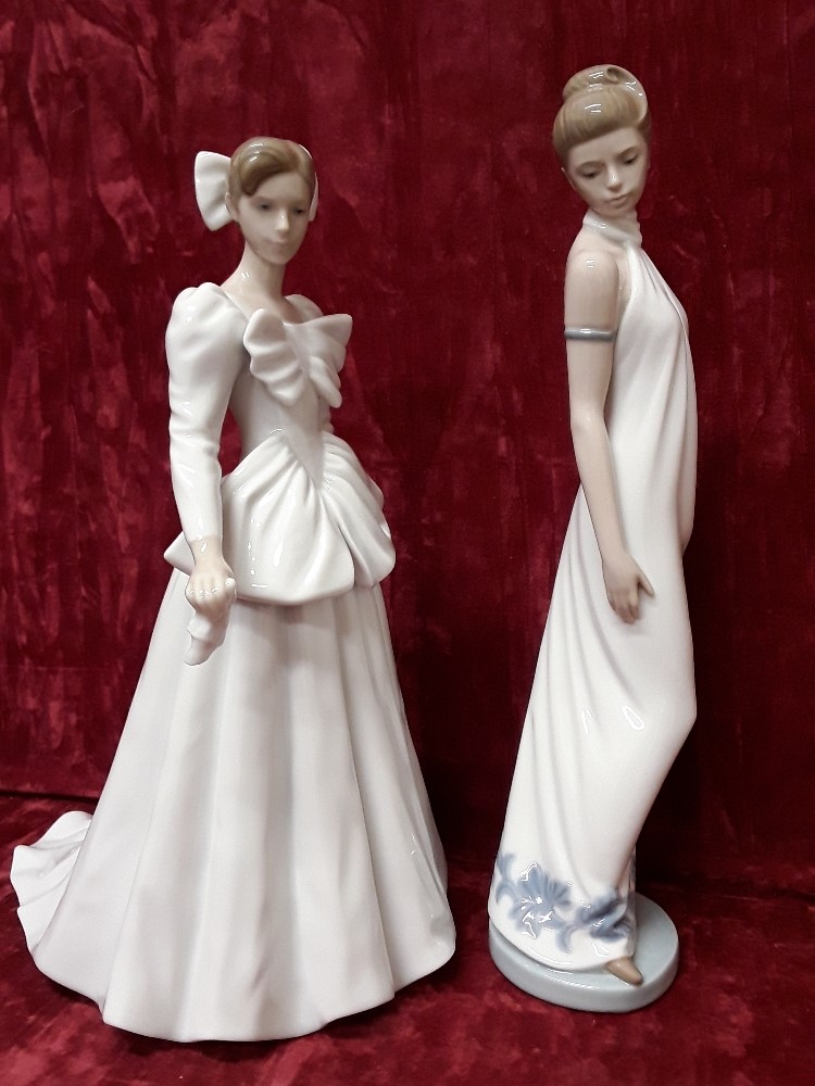 A pair of tall elegant Lladro figurines – both marked Nao Daisa 1994.