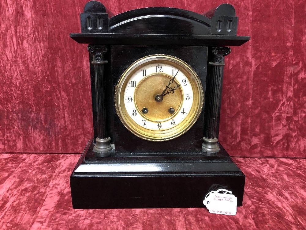 A black marble clock.