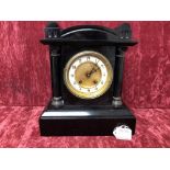 A black marble clock.