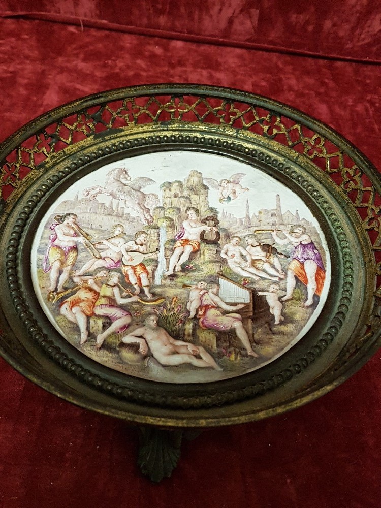 An early 20th Century Capo de Monte porcelain disc with a decorated metallic border/edge.