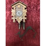 A West German wooden cuckoo clock.