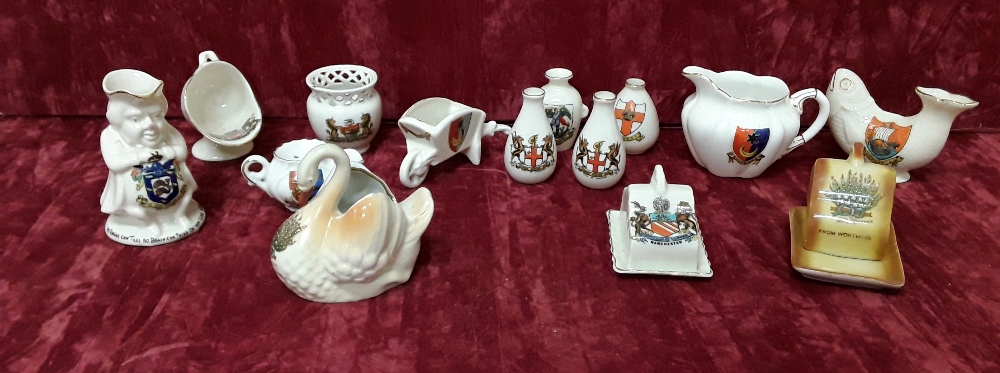 A collection of crested ware including Shelley. 14 pieces in total.