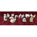 A collection of crested ware including Shelley. 14 pieces in total.