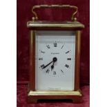 A brass carriage clock stamped Duverdrey and Bloquel France to the base.
