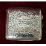 A silver cigarette box hallmarked Chester 1908.