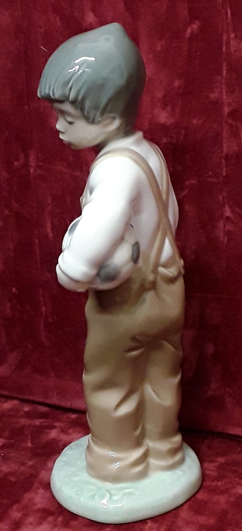 A Lladro Nao Daisa 1988 figurine of boy with a football. - Image 3 of 4