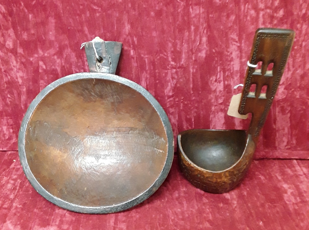 An early 20th Century Masai Tribal food bowl plus a vintage wooden drinking ladle.