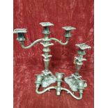 A pair of decorative silver plated candelabra.