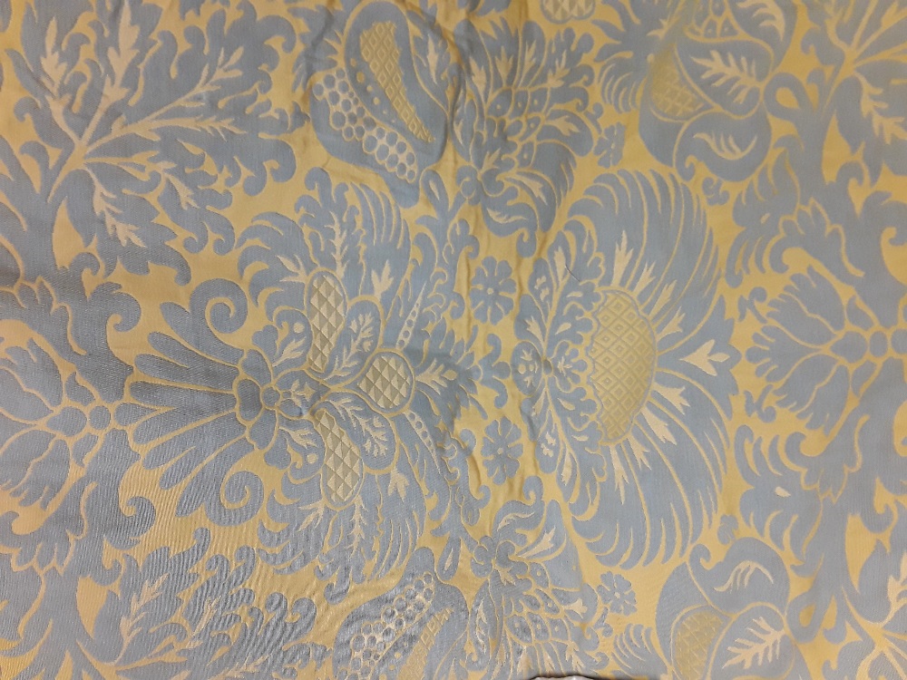 A pair of grey and yellow patterned machine woven full length curtains.