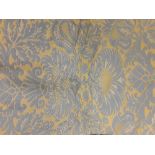 A pair of grey and yellow patterned machine woven full length curtains.