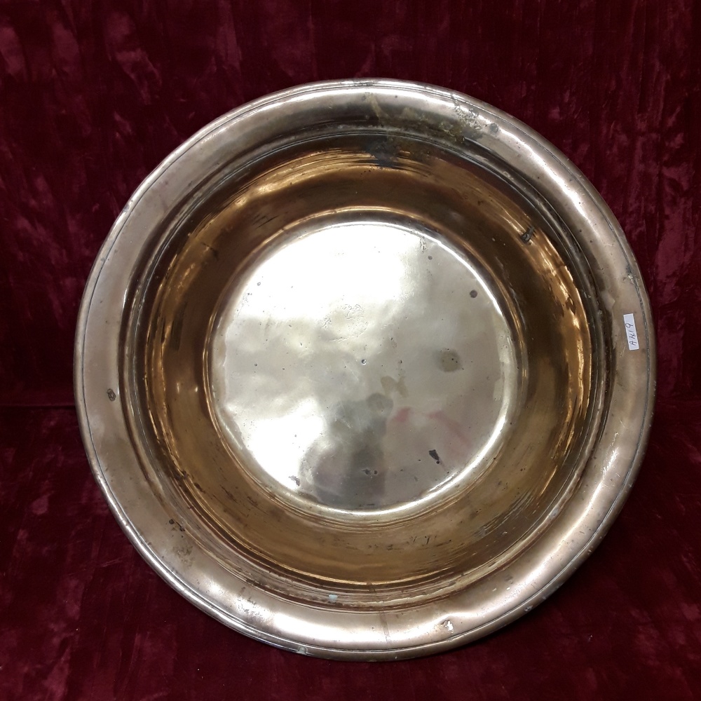 A large heavy hammered brass bowl. - Image 2 of 2