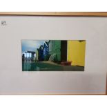 A framed photographic print ‘The Red Bowl’ by Baxter Bradford, signed. Beach huts scene Mudeford.