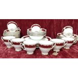 A Royal Stafford Bone China ‘Park Lane’ part tea set in burgundy and gold.