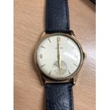 An OMEGA Gentleman's manual wind 9ct gold wristwatch.