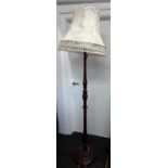 A turned mahogany standard lamp stand with circular stepped base