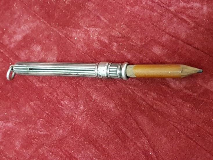 A hallmarked silver S. MORDAN & Co. pencil holder.