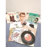 A selection of 45 rpm 7” records dating between 1958 and 1964.